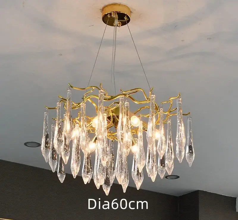 Elegant gold-toned modern nest crystal led chandelier with cascading clear crystal teardrop pendants for living room