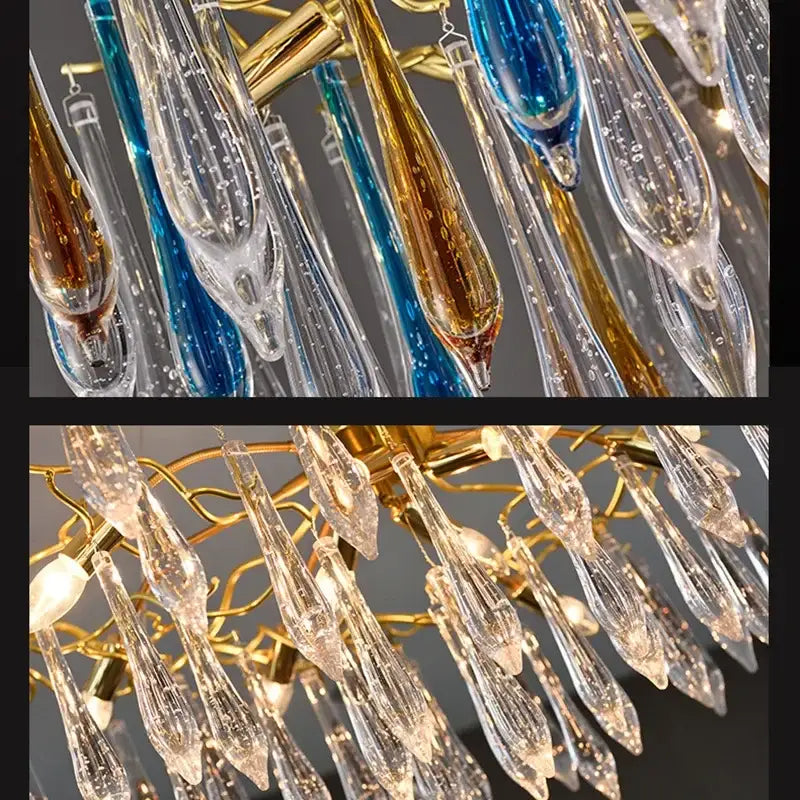 A modern nest crystal led chandelier with teardrop glass pendants in clear blue and amber on a gold frame
