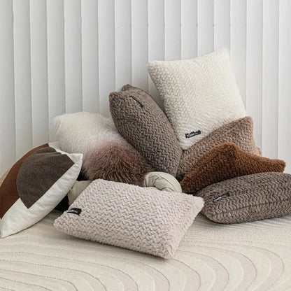 A cozy collection of modern neutral geometric texture plush cushion covers in beige taupe and brown for living room decorbites