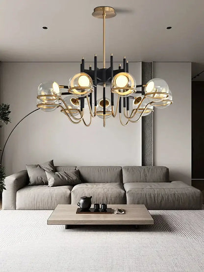 Modern nordic pendant light with gold-toned metal arms and decorbites clear glass clear glass ball globes