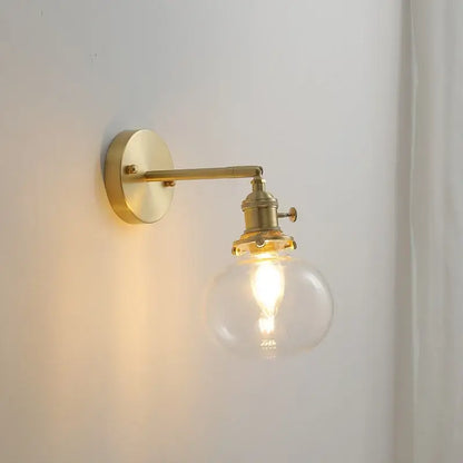 Modern nordic brass glass ball wall lamp with clear globe and exposed filament bulb perfect for bedroom decorbites glass ball