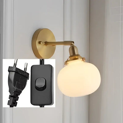 Gold-toned modern nordic brass glass ball wall lamp with frosted glass globe and ribbed sconce for bedroom decorbites glass ball