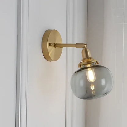 Modern nordic brass glass ball wall lamp with frosted glass globe and gold-toned brass hardware for bedroom decorbites glass ball