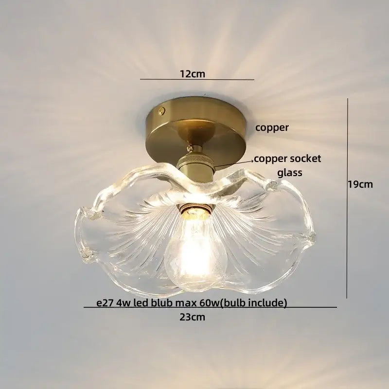 Modern nordic clear glass ceiling light fixture with fluted petal design and antique brass copper base for bedroom use
