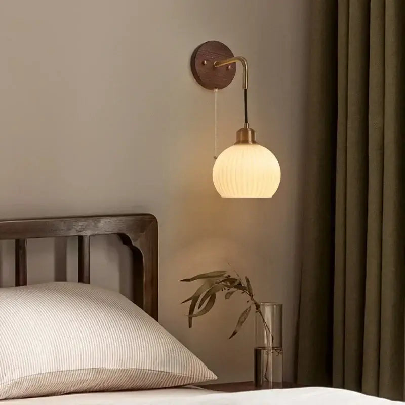 Modern nordic copper adjustable led wall light with warm-toned ribbed glass globe brass accents and dark wood mount