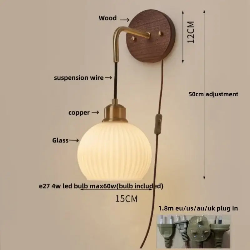 Modern nordic copper adjustable led wall light with a ribbed glass globe, brass finish, and wooden mount for bedroom decorbites wall light