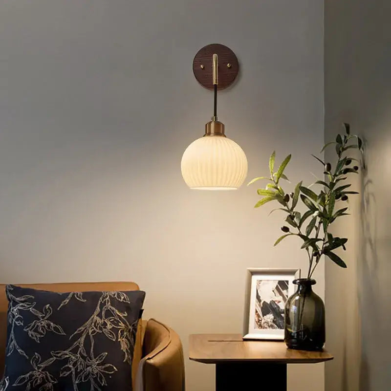 Modern nordic copper adjustable led wall light with warm-toned ribbed glass globe and brass fixture for bedroom decorbites copper adjustable