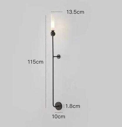Black metal decorbites copper wall lamp with slender stem, circular base, and frosted glass candle-style bulb for living room