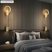 Modern nordic led black gold wall lamp with gold-toned circular sconces and cylindrical pendant lights for bedroom use