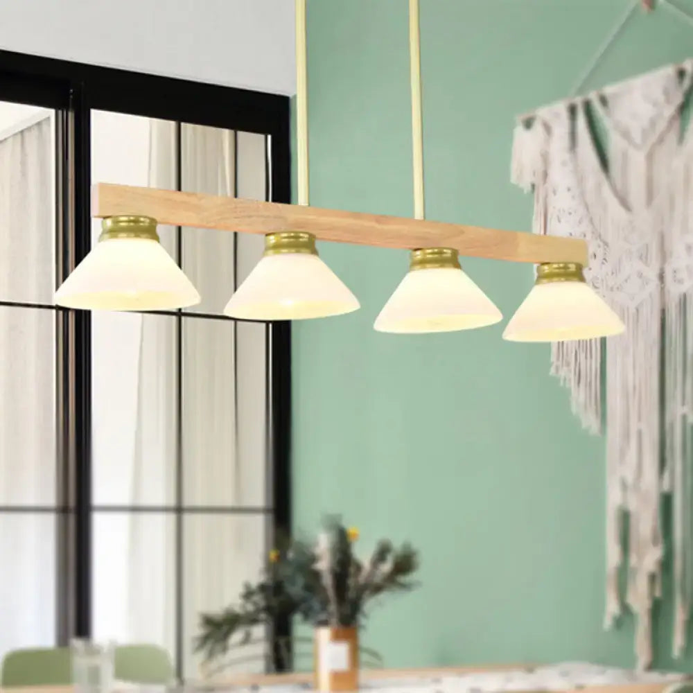 Modern farmhouse nordic linear wood hanging light with natural wood beam brass accents and four frosted glass shades