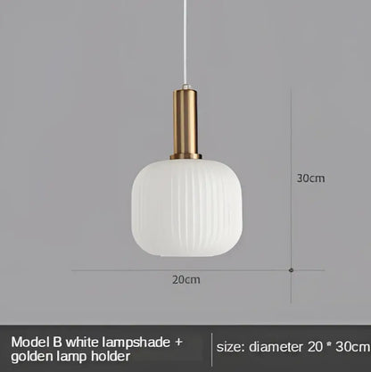 Modern nordic pendant lights with a white ribbed glass led shade and golden metal holder for dining room lighting