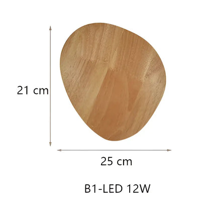 A light brown wooden wall lamp with smooth natural grain and slightly irregular edges for bedroom use
