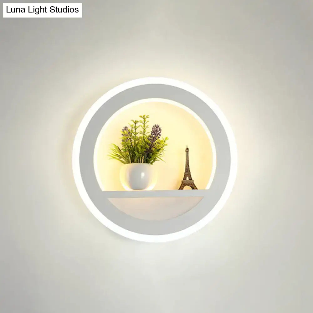 Modern nordic wall light with sleek white frame bulb included features integrated led ring and illuminated shelf with decor