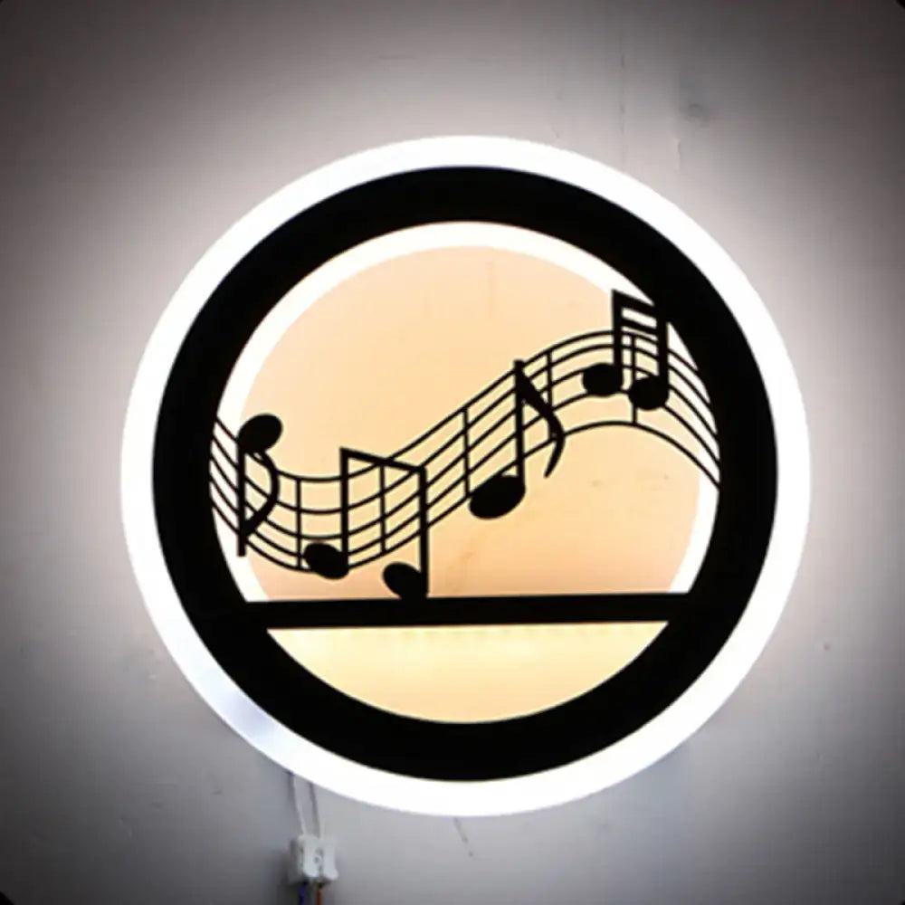 Modern nordic wall light with shelf features a circular amber backlight with black musical note silhouette bulb included