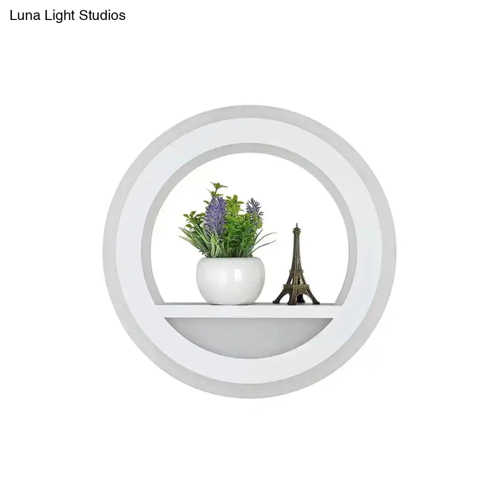 Modern nordic white wall light with circular shelf includes bulb and holds ceramic pot with purple flowers and eiffel tower