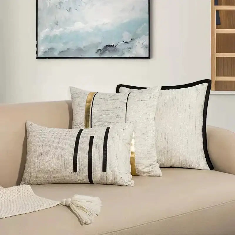 Set of modern off-white cushion covers with black stripe jacquard and gold geometric accents for living room decorbites