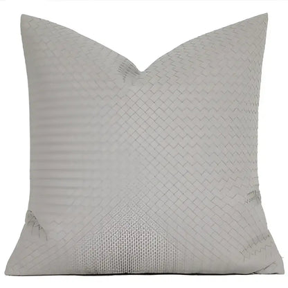 A light gray throw pillow with subtle woven texture featuring decorbites geometric faux leather pillow cover design