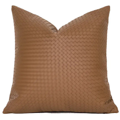 Tan woven fabric pillow with diamond-patterned texture and geometric faux leather pillow cover for living room decorbites