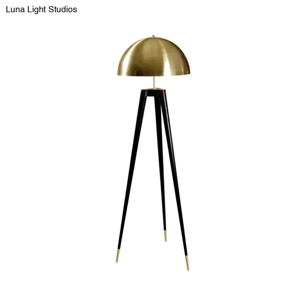 Decorbites™ modern black metal floor lamp with sleek brass dome, black tripod base, gold-tipped legs, 110v-120v use