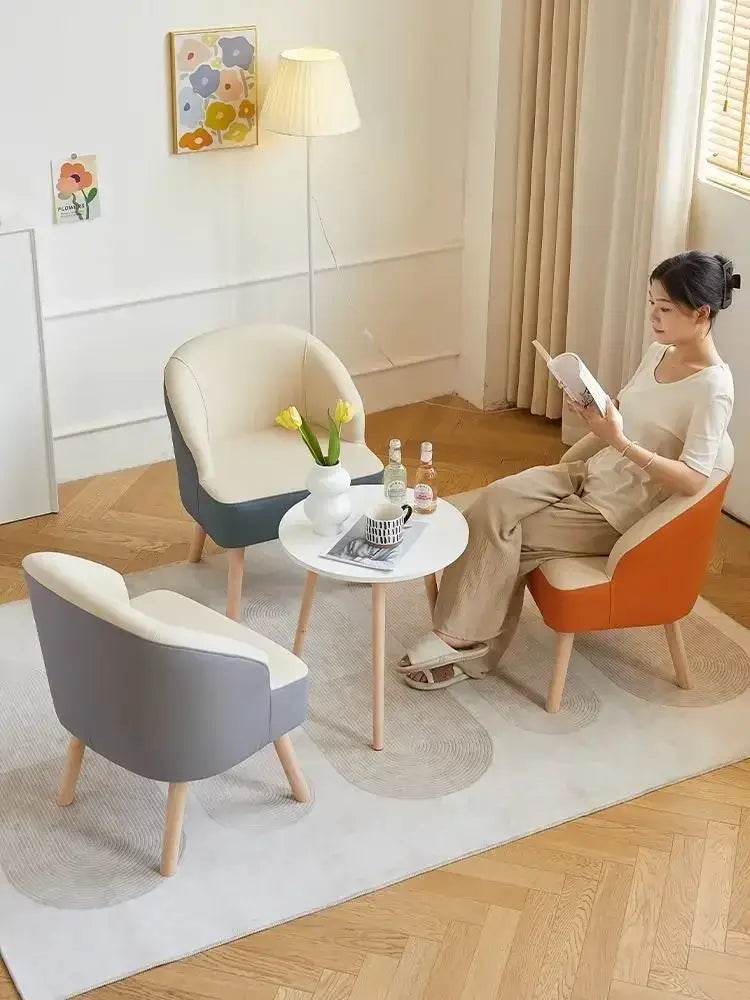 Modern orange and cream leather single sofa chair with wooden legs for living room seating