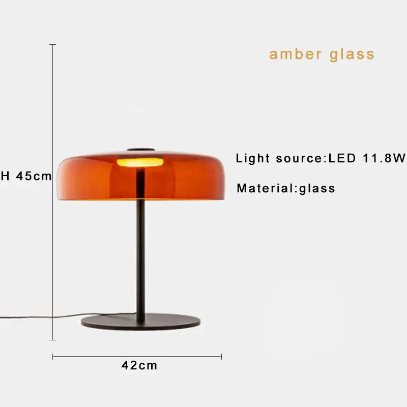 Modern orange glass table lamp with amber glass shade and sleek black metal base for minimalist bedroom decorbites glass table lamp