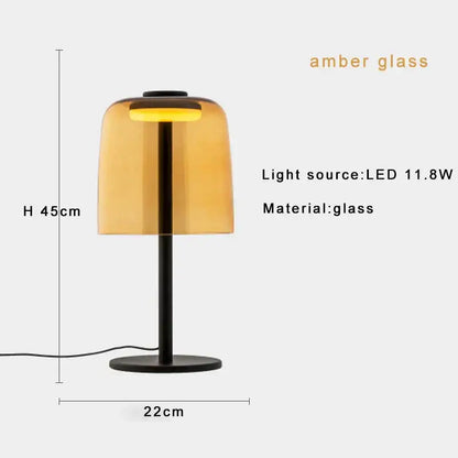 Amber glass table lamp with sleek black metal base and stem for modern minimalist bedroom decorbites glass table lamp