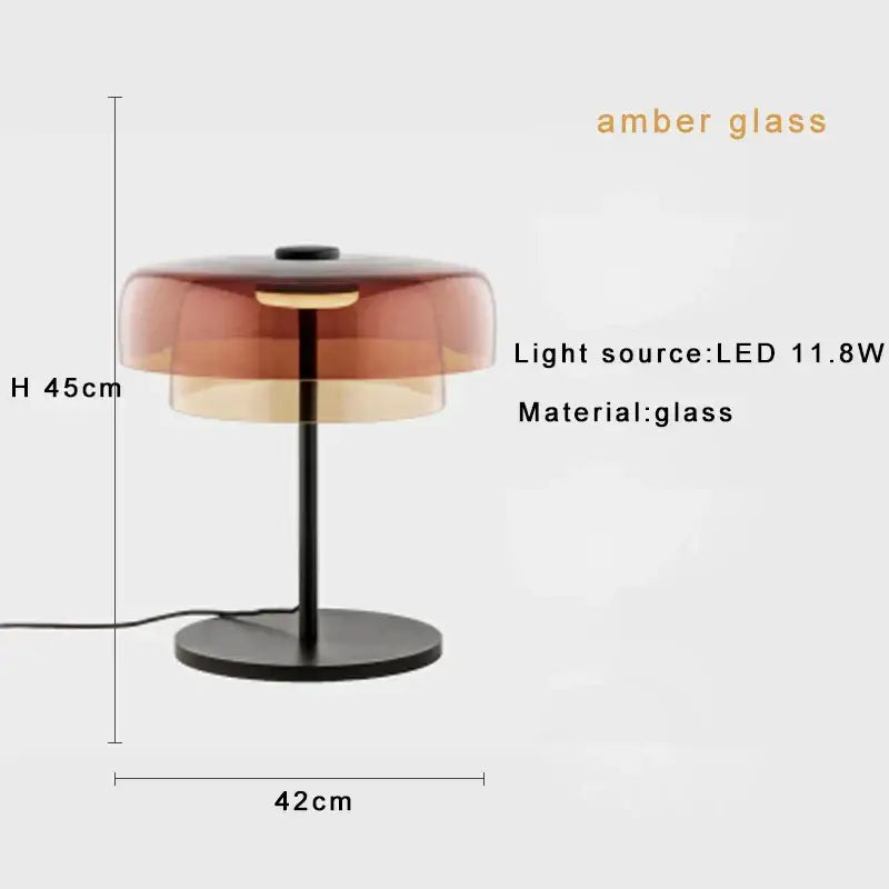 Modern orange glass table lamp with a layered amber glass shade and black metal base for minimalist decorbites glass table lighting