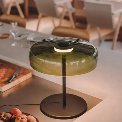 Modern olive-green glass table lamp with sleek black metal base and stem for minimalist bedroom decorbites glass table lamp