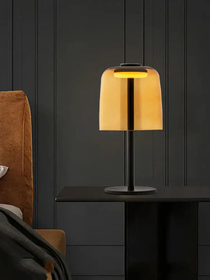Modern orange glass table lamp with warm amber shade and sleek black metal base, ideal minimalist decorbites glass table lamp