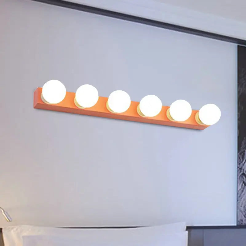 Modern orange and white rectangular vanity light fixture with five round bulbs ideal for bedroom use