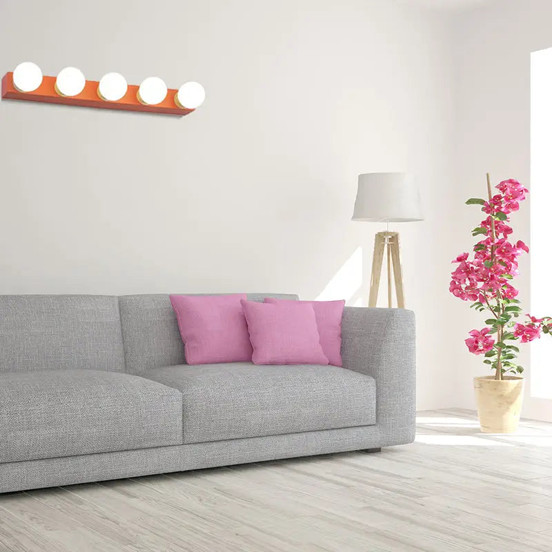 Modern orange and white vanity light fixture with five round bulbs for bedroom wall mounting