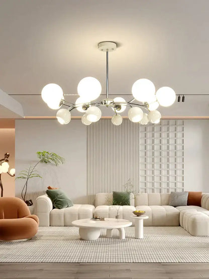 Modern white globe chandelier with chrome rod and arms featured as living room pendant lamp by decorbites cream living