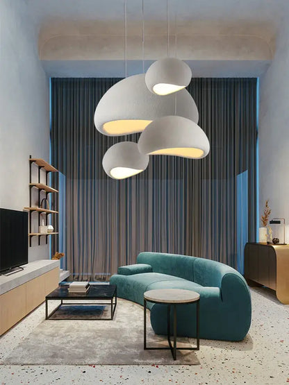 Teal velvet curved sofa paired with modern organic off-white cloud pendant lamp decorbites handmade led chandelier design