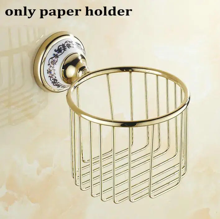 Modern ornate gold and white porcelain bath hardware set featuring a gold-toned metal wire basket with decorative backplate