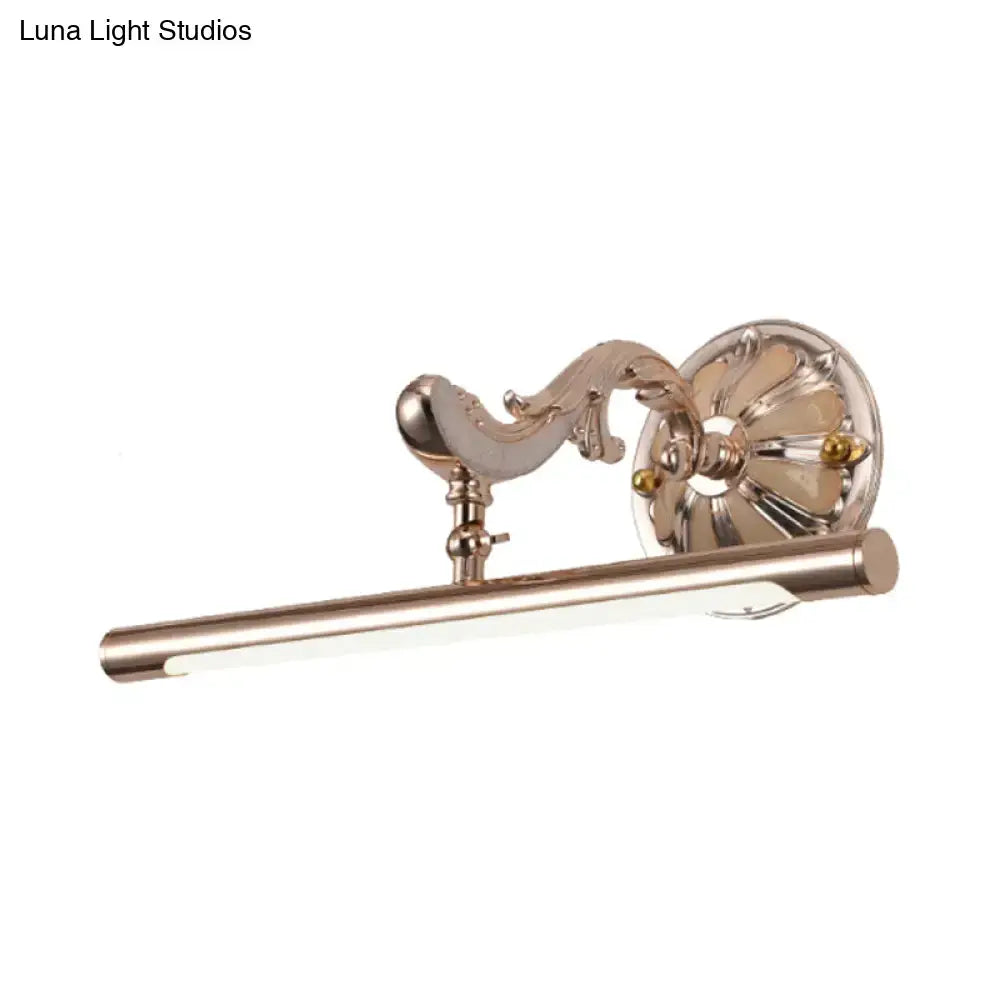Antique brass-finished wall mount bathroom lamp with ornate scrollwork and sleek cylindrical led bar lighting fixture