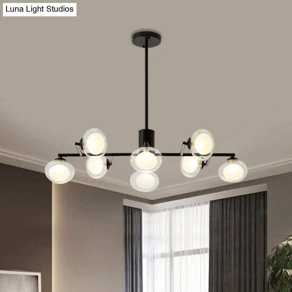 Modern black metal chandelier with frosted glass globe bulbs in black white for elegant island lighting decor