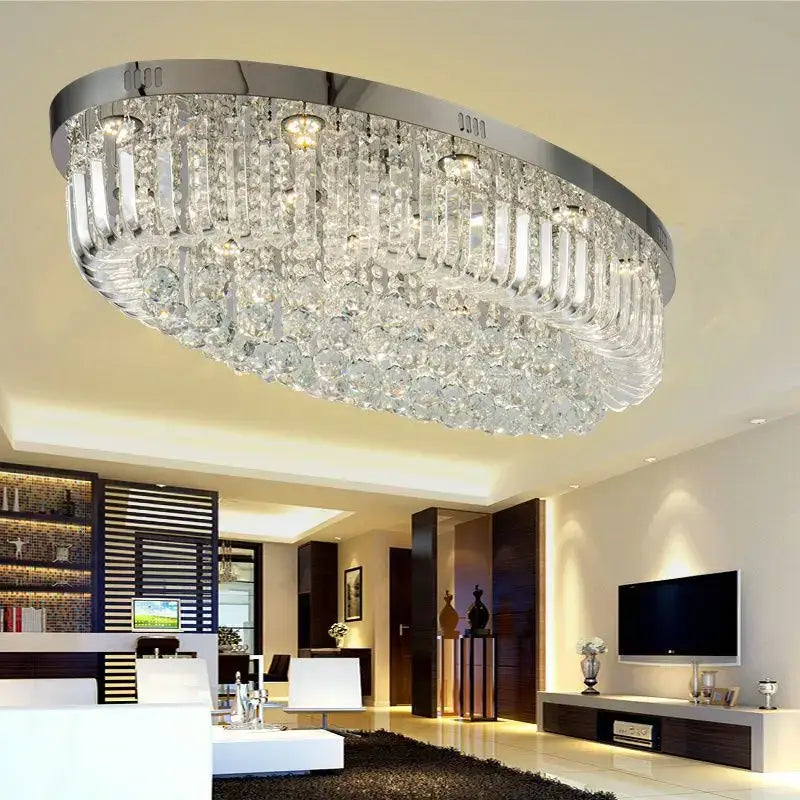 A modern oval chrome and gold crystal ceiling light with clear prisms perfect for dining room decorbites crystal dining