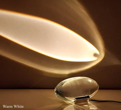 Modern oval crystal led table lamp with warm white light, translucent glass base, and sleek design for bedroom decorbites lighting