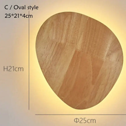 A warm-toned oval led wooden wall lamp with natural wood grain finish and smooth edges for bedroom decorbites led wooden