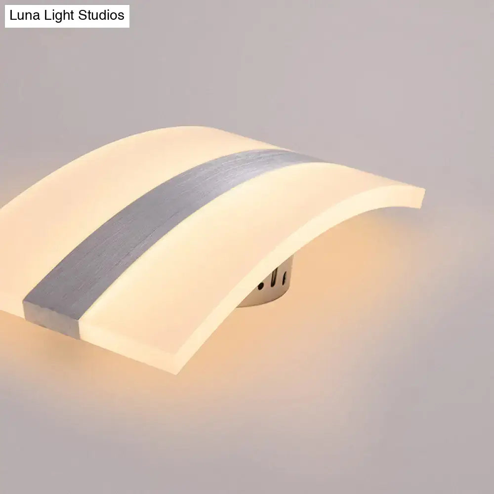 Modern oval rectangular convex led wall sconce with warm glow, white acrylic diffuser, and silver metallic stripe for bedroom use