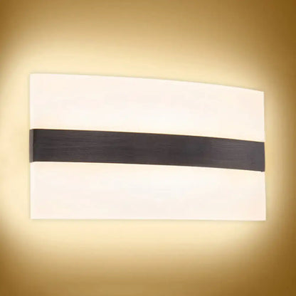 Modern oval rectangular convex led wall sconce with sleek white diffuser and horizontal matte black accent bar for bedroom lighting