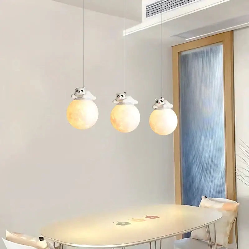 Three white glass pendant bedroom wall lamps with glowing orbs and panda figurines for decorbites bear bedroom decor
