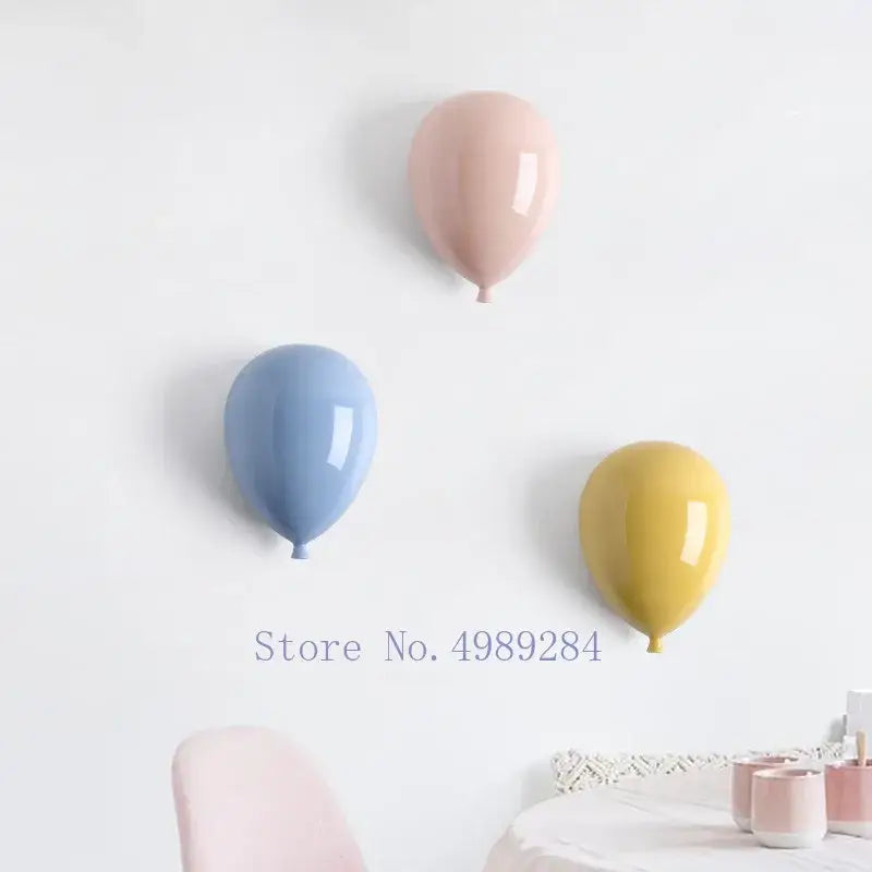 Modern pastel ceramic balloon wall hanging decoration in glossy pink blue and yellow for children room