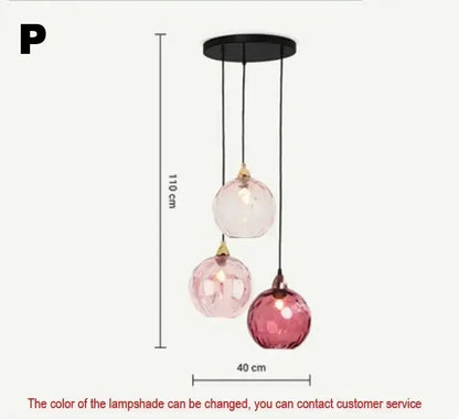 Modern pastel glass pendant light with seven pink spherical shades and polished chrome details for dining rooms under square meters