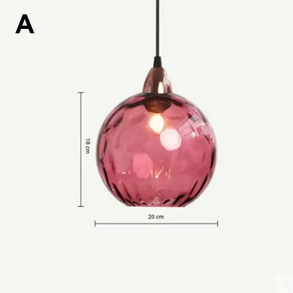 Modern pastel glass pendant light with seven textured pink globes and polished chrome rose gold metal fixture for dining room