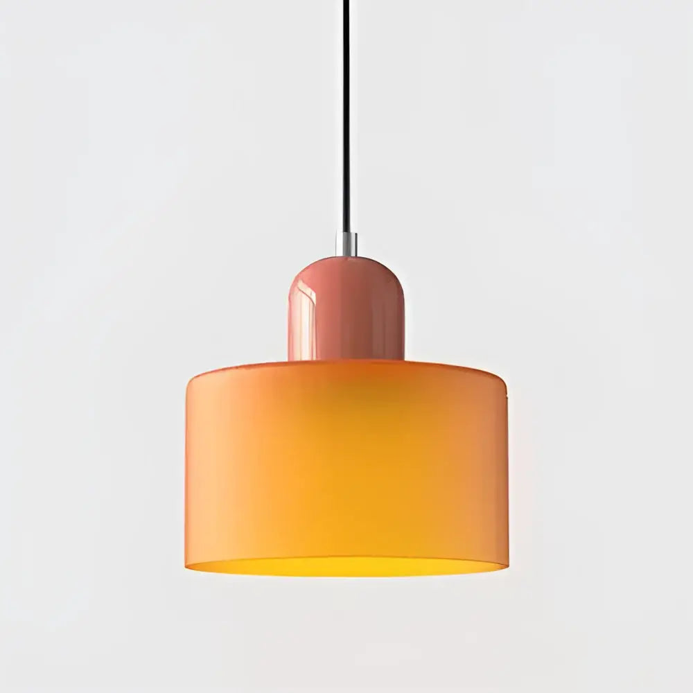 Modern pastel pendant light with a gradient orange stained glass shade and matte pink cylindrical top for kitchen dining room