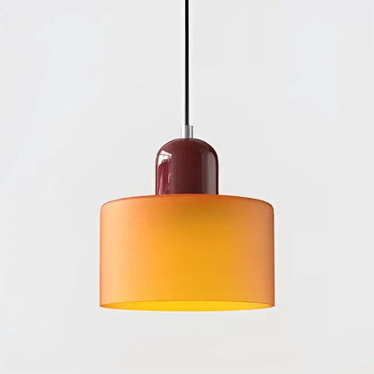 Modern pendant light with gradient orange and yellow stained glass shade and burgundy ceramic fixture for kitchen dining