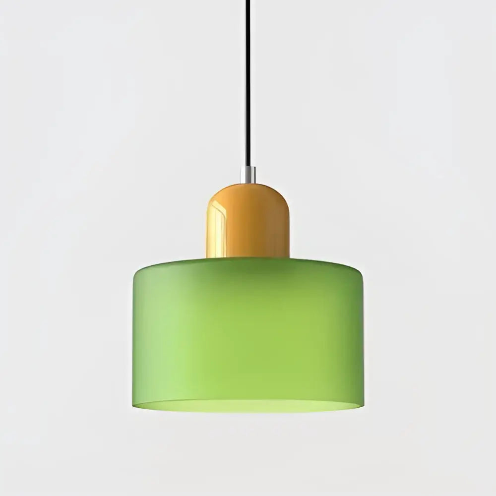Modern pendant light with frosted green stained glass cylindrical shade and amber rounded top cap cord pendant