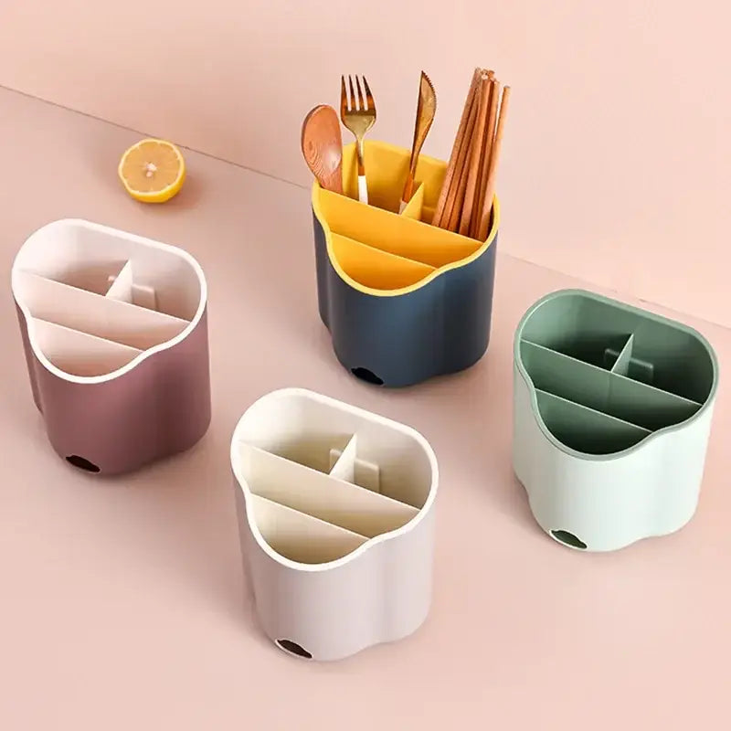 A modern pastel-colored plastic double layer cutlery holder with wavy design and compartments for kitchen organization