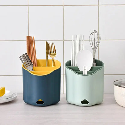 Two modern pastel plastic double layer cutlery holders with wavy design and contrasting yellow and green interiors